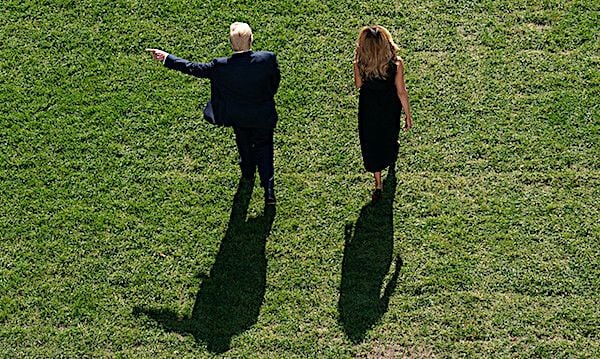 President Donald J. Trump and First Lady Melania Trump greet White House staff members waving American flags as they depart the South Portico entrance of the White House Thursday, Oct. 22, 2020, before boarding Marine One on the South Lawn to begin their trip to Nashville, Tennessee. (Official White House photo by Tia Dufour)
