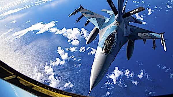 An Air Force F-16 Fighting Falcon conducts an aerial refuel with a KC-135 Stratotanker during Cope North near Andersen Air Force Base, Guam, Feb. 18, 2021. The annual exercise promotes stability and security throughout the Indo-Pacific. (U.S. Air Force photo by Senior Airman Duncan C. Bevan)
