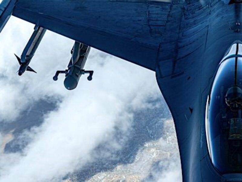 An F-16 Fighting Falcon, assigned to the 64th Aggressor Squadron, receives fuel from a KC-135 Stratotanker assigned to the 91st Air Refueling Squadron, MacDill Air Force Base, Florida, while participating in Red Flag-Nellis 22-2 over the Nevada Test and Training Range, Nevada, March 16, 2022. (U.S. Air Force photo by Airman 1st Class Josey Blades)