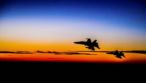 Two Marine Corps F/A-18D Hornets fly over the U.S. Central Command area of responsibility, May 18, 2021. (U.S. Air Force photo by Tech. Sgt. Robert Harnden)