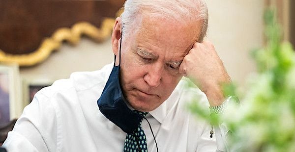 President Joe Biden takes notes during a briefing on the shootings in Atlanta Wednesday, March 17, 2021, in the Oval Office Dining Room of the White House. (Official White House photo by Adam Schultz)