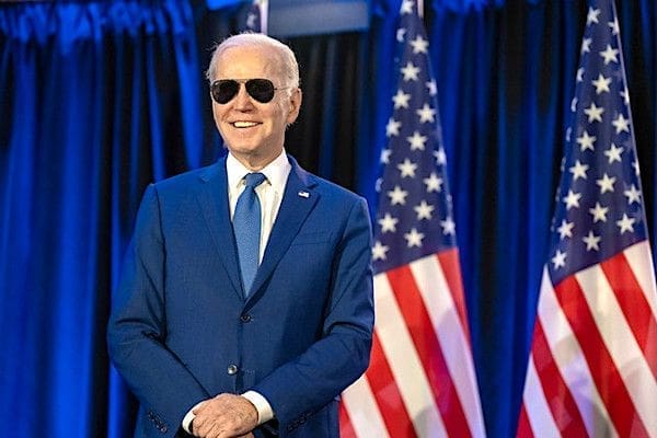 Joe Biden looks on as First Lady Jill Biden delivers remarks at an embassy meet and greet, Thursday, March 23, 2023, at the Fairmont Chateau Laurier in Ottawa, Ontario, Canada. (Official White House photo by Adam Schultz)