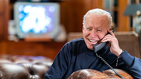President Joe Biden talks on the phone with service members attending Super Bowl LV watch parties in Kabul and aboard the USS Nimitz Sunday, Feb. 7, 2021, at the Lake House in Wilmington, Delaware. (Official White House photo by Adam Schultz)