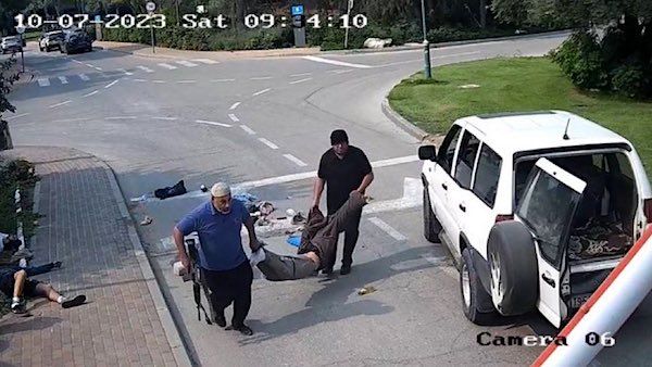 Two UNRWA employees are caught on a security camera after killing an Israeli civilian on Oct. 7, 2023, and kidnapping his body.