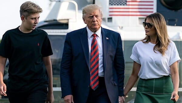 President Donald J. Trump, First Lady Melania Trump, and their son, Barron, walk across the South Lawn of the White House Sunday, August 18, 2019, following their stay in Bedminster, New Jersey. (Official White House Photo by Tia Dufour)