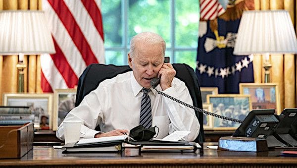 President Joe Biden speaks on the phone with Israeli Prime Minister Benjamin Netanyahu on Wednesday, May 12, 2021, in the Oval Office of the White House. (Official White House photo by Adam Schultz)