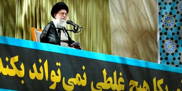 Ayatollah Ali Khamenei above banner reading, 'America cannot do a d--- thing'