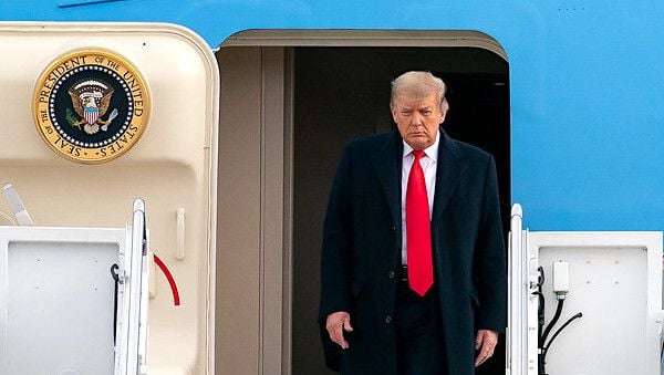 President Donald J. Trump disembarks Air Force One on his arrival to Joint Base Andrews, Maryland, Thursday, Dec. 31, 2020, returning from his Christmas holiday in Palm Beach, Florida. (Official White House photo by Tia Dufour)