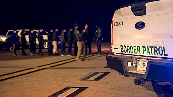 U.S. Customs and Border Protection agents guide illegal aliens to board C-17 Globemaster III aircraft at the Tucson International Airport, Arizona, Thursday, Jan. 23, 2025. (U.S. Dept. of Defense photo by Senior Airman Devlin Bishop)