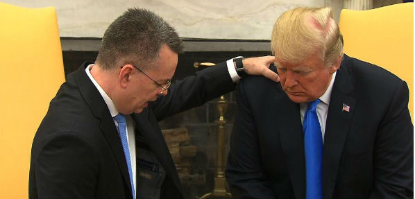 Pastor Andrew Brunson prays for President Trump in the Oval Office after his return from Turkey.