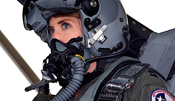 Air Force Capt. Michelle 'Mace' Curran, an F-16 Fighting Falcon pilot with the 355th Fighter Squadron, looks up during fighter jet launch preparations on the flightline, March 4, 2017. (U.S. Air Force photo by Staff Sgt. Samantha Mathison)