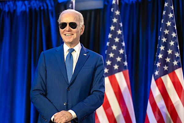 Joe Biden looks on as First Lady Jill Biden delivers remarks at an embassy meet and greet, Thursday, March 23, 2023, at the Fairmont Chateau Laurier in Ottawa, Ontario, Canada. (Official White House photo by Adam Schultz)