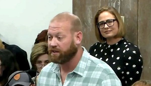 Kyrsten Sinema, right, had a romantic affair with her bodyguard Matthew Ammel, center (Arizona Capitol TV)
