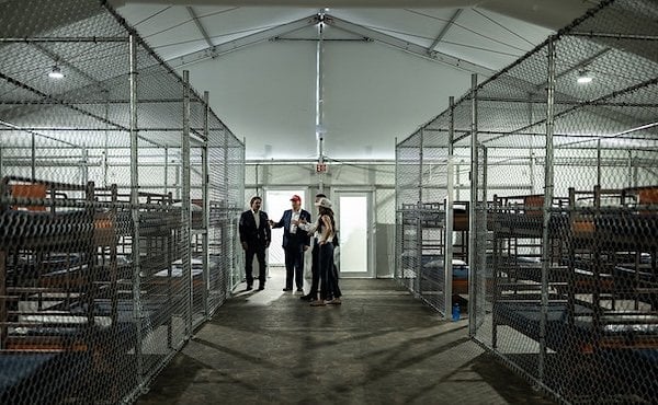 President Donald Trump participates in a walking tour of the immigration detention center nicknamed 'Alligator Alcatraz,' Tuesday, July 1, 2025, in Ochopee, Florida. (Official White House photo by Daniel Torok)
